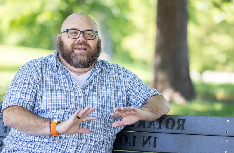 Jonathan Springborn sitting on a park bench.